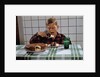 Boy Eating a Slice of Cake by Anonymous
