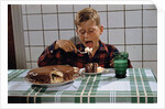 Boy Eating a Slice of Cake by Anonymous