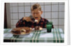 Boy Eating a Slice of Cake by Anonymous
