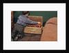 Boy Removing Fire Engine from Toy Chest by Anonymous