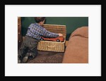 Boy Removing Fire Engine from Toy Chest by Anonymous