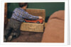 Boy Removing Fire Engine from Toy Chest by Anonymous