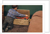 Boy Removing Fire Engine from Toy Chest by Anonymous