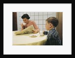 Boy Eating Cookies and Milk as Mom Reads by Anonymous