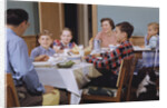 Family Eating at the Dinner Table by Anonymous
