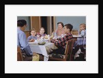 Family Eating at the Dinner Table by Anonymous