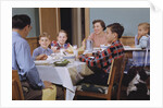 Family Eating at the Dinner Table by Anonymous