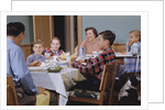 Family Eating at the Dinner Table by Anonymous