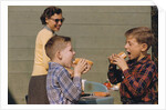 Boys Eating Hot Dogs by Corbis