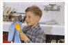 Boy Drying Serving Spoon by Anonymous
