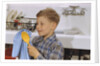 Boy Drying Serving Spoon by Anonymous