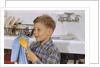 Boy Drying Serving Spoon by Anonymous