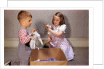 Boy Holding Kitten by Anonymous
