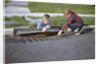 Boys Looking into Grate by Anonymous