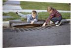 Boys Looking into Grate by Anonymous