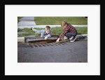 Boys Looking into Grate by Anonymous