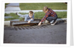 Boys Looking into Grate by Anonymous