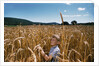 Boy Standing in Field of Wheat by Anonymous
