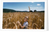 Boy Standing in Field of Wheat by Anonymous