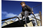 Boy Playing on Playground Slide by Anonymous
