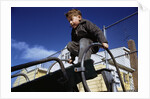 Boy Playing on Playground Slide by Anonymous