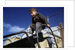 Boy Playing on Playground Slide by Anonymous