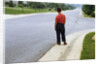 Boy Waiting on Suburban Street by Anonymous