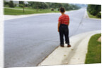 Boy Waiting on Suburban Street by Anonymous