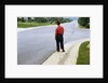 Boy Waiting on Suburban Street by Anonymous