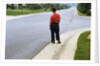Boy Waiting on Suburban Street by Anonymous