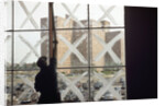 Man Cleaning Windows near Housing Project by Anonymous