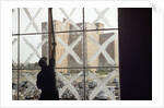 Man Cleaning Windows near Housing Project by Anonymous