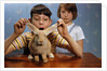 Annoying Brother Playing With His Sister's Pet Rabbit by Anonymous