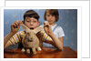 Annoying Brother Playing With His Sister's Pet Rabbit by Anonymous