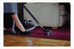 Woman Vacuuming Rug by Anonymous
