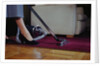 Woman Vacuuming Rug by Anonymous