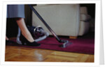 Woman Vacuuming Rug by Anonymous