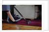 Woman Vacuuming Rug by Anonymous