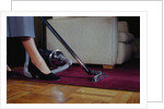 Woman Vacuuming Rug by Anonymous