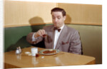 Businessman Pouring Syrup on Pancakes by Corbis