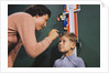 Mother Measuring Boy's Height by Anonymous