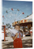 Boy Eating Cotton Candy at Fair by Anonymous