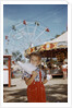 Boy Eating Cotton Candy at Fair by Anonymous