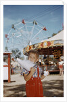 Boy Eating Cotton Candy at Fair by Anonymous