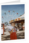 Boy Eating Cotton Candy at Fair by Anonymous