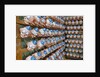 Clown Heads on Rack in Factory by Anonymous