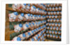 Clown Heads on Rack in Factory by Anonymous