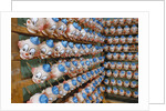 Clown Heads on Rack in Factory by Anonymous