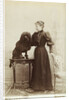 Albumen Print Card Showing Woman with a Black Miniature Poodle by Anonymous