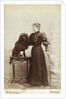 Albumen Print Card Showing Woman with a Black Miniature Poodle by Anonymous